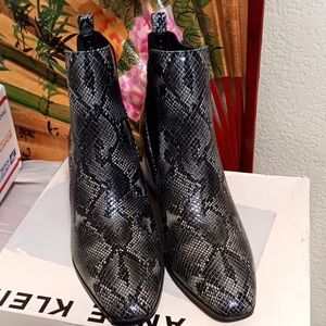 Women Snake skin Anne kleinankle boots.
